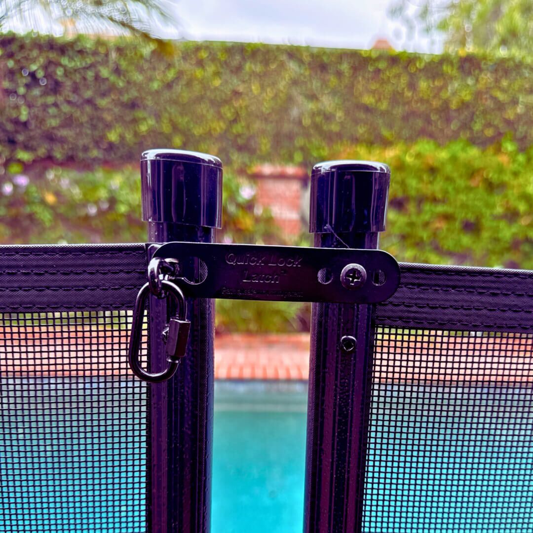 Quick Lock Latch Kit on black fence Quick Lock Latch Kit on black fence