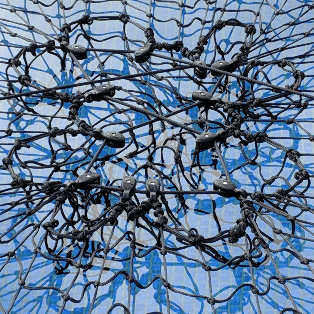 Pulley String Close Up Pulley String Tied into Pulleys to create a Net Central Tensioning System